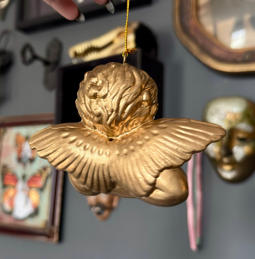 Vintage Style Cherub Leaning On Palm Ornament