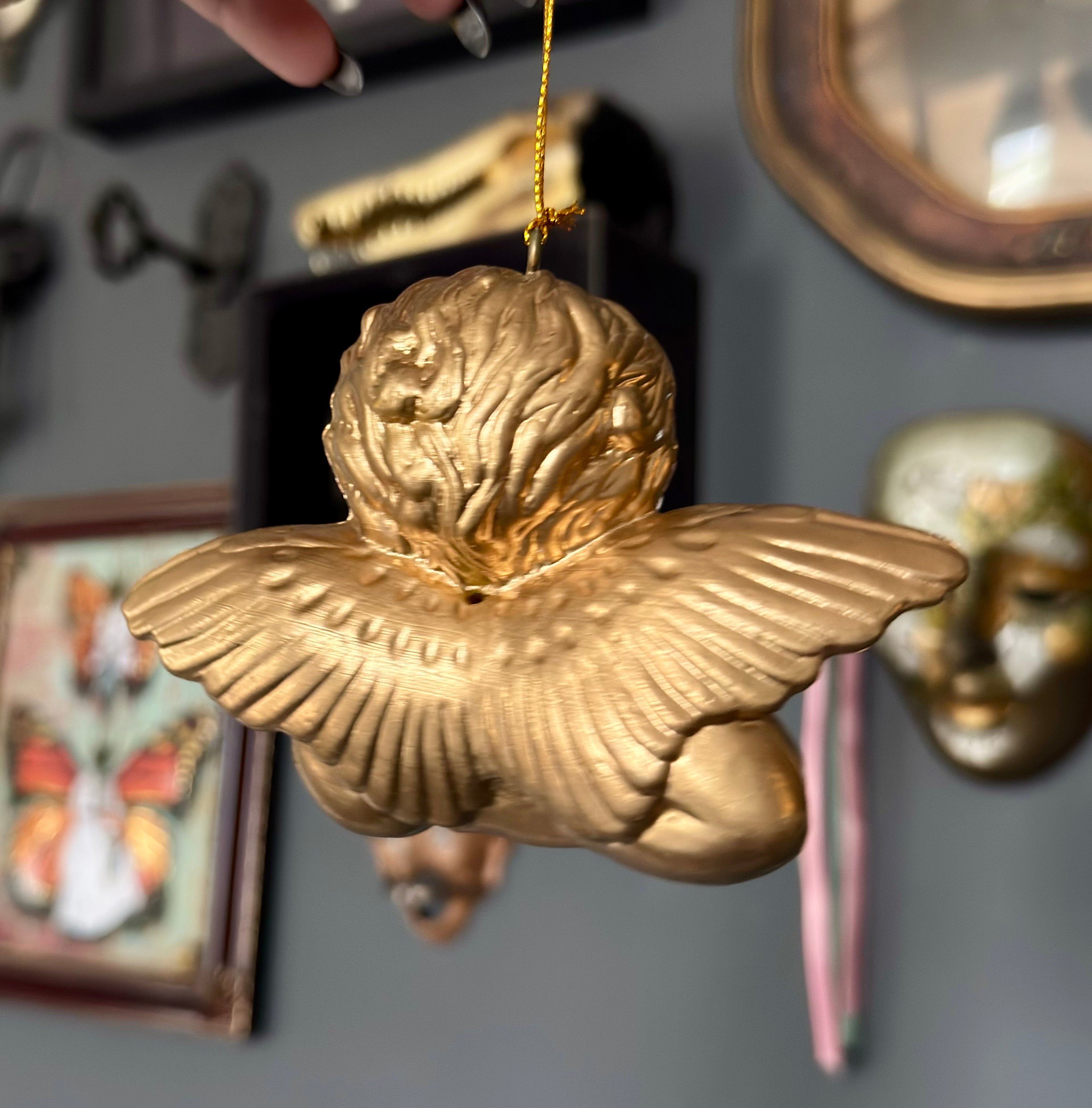 Vintage Style Cherub Leaning On Palm Ornament