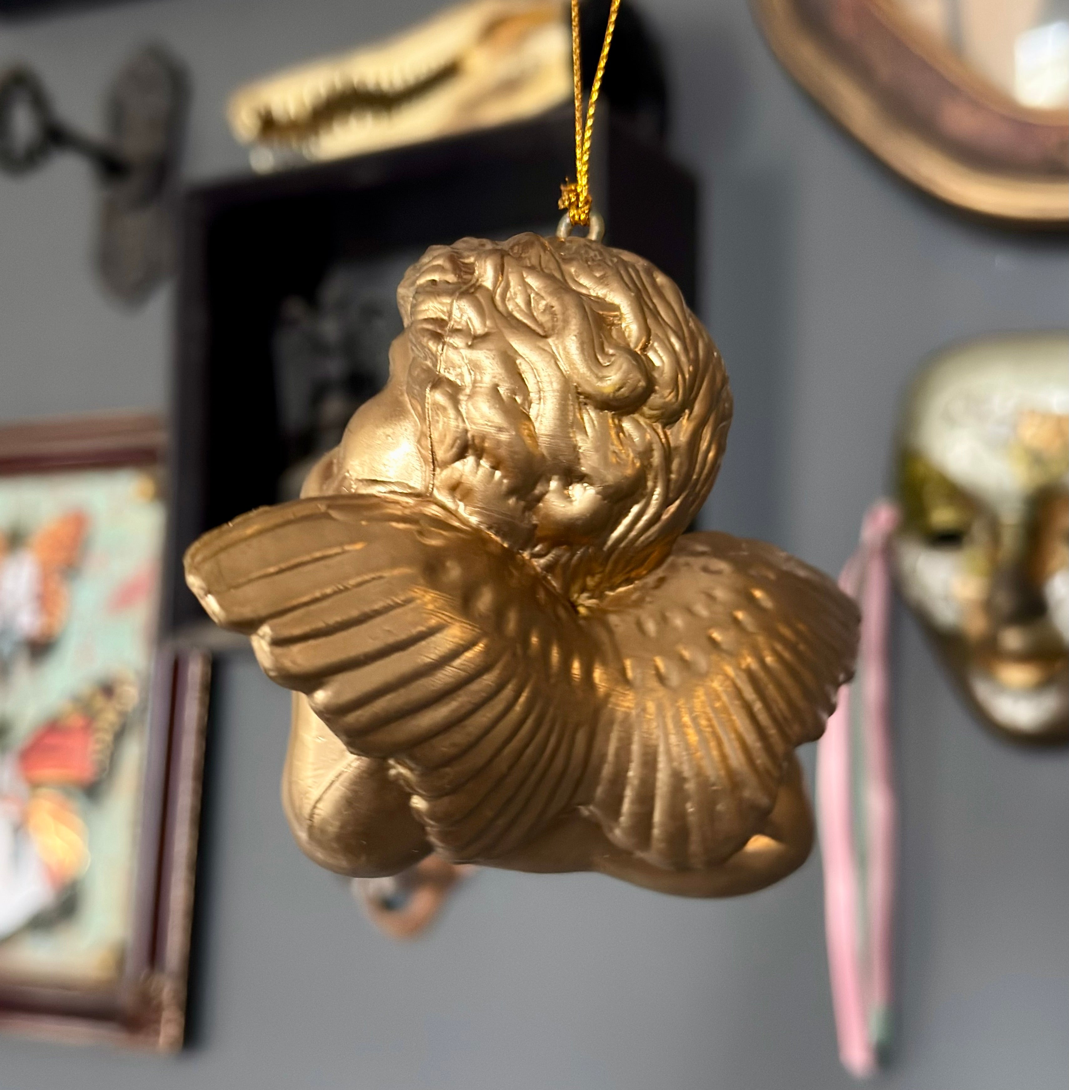 Vintage Style Cherub Leaning On Palm Ornament