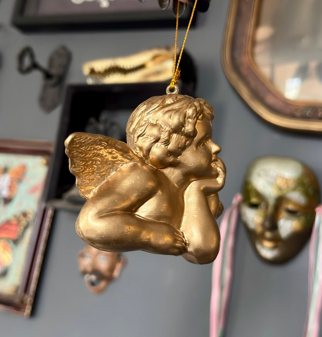 Vintage Style Cherub Leaning On Palm Ornament