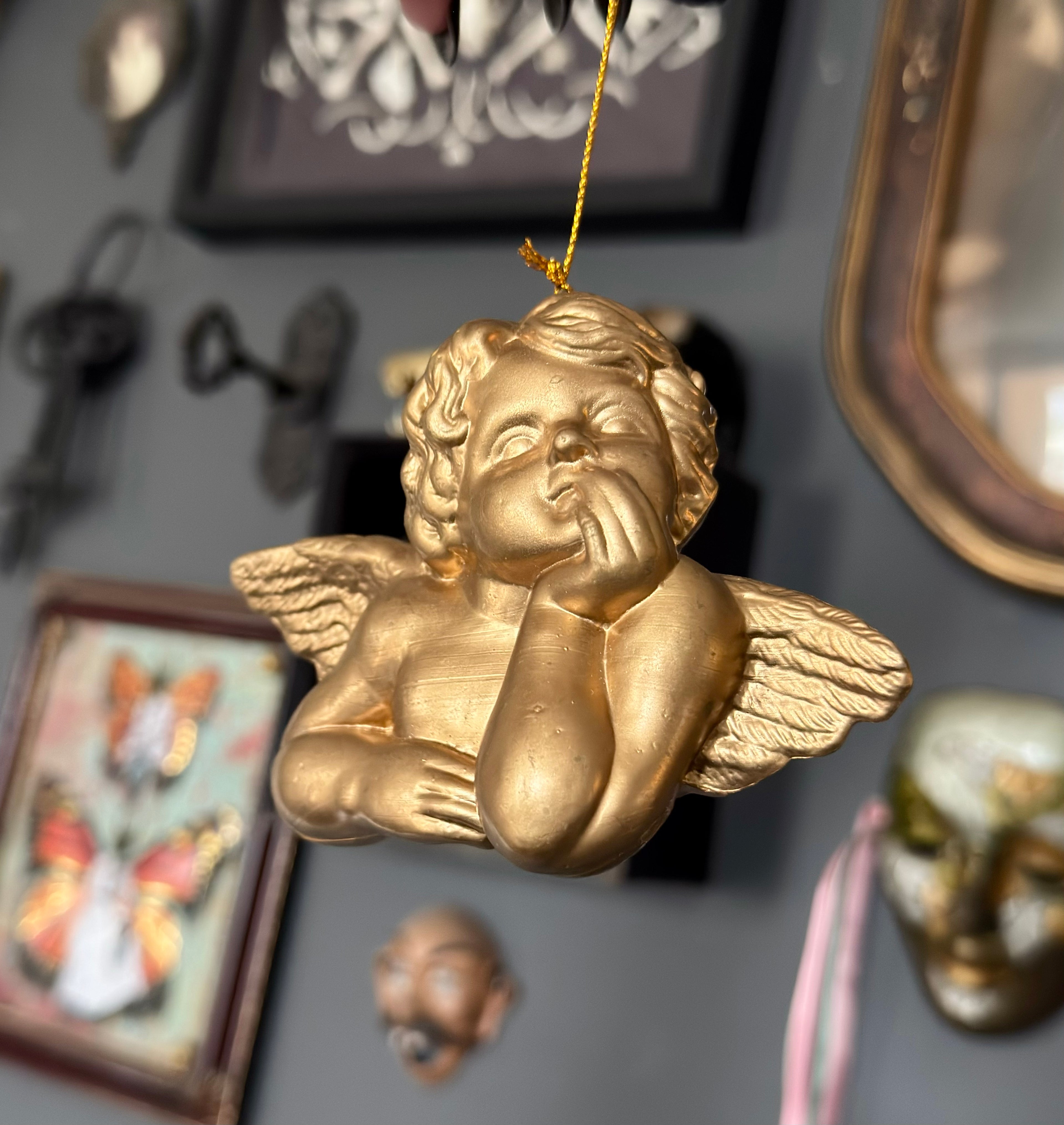 Vintage Style Cherub Leaning On Palm Ornament